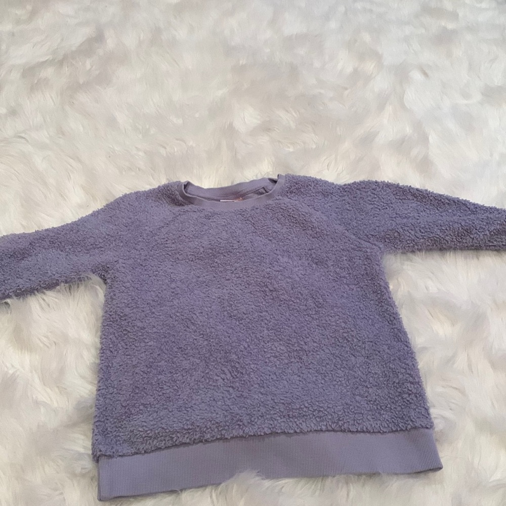 Blue and purple sweaters